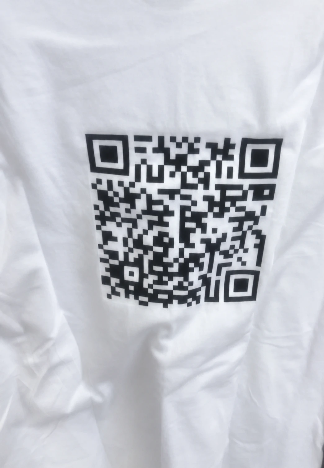 White t-shirt with the Young Rose logo on the front, another view
